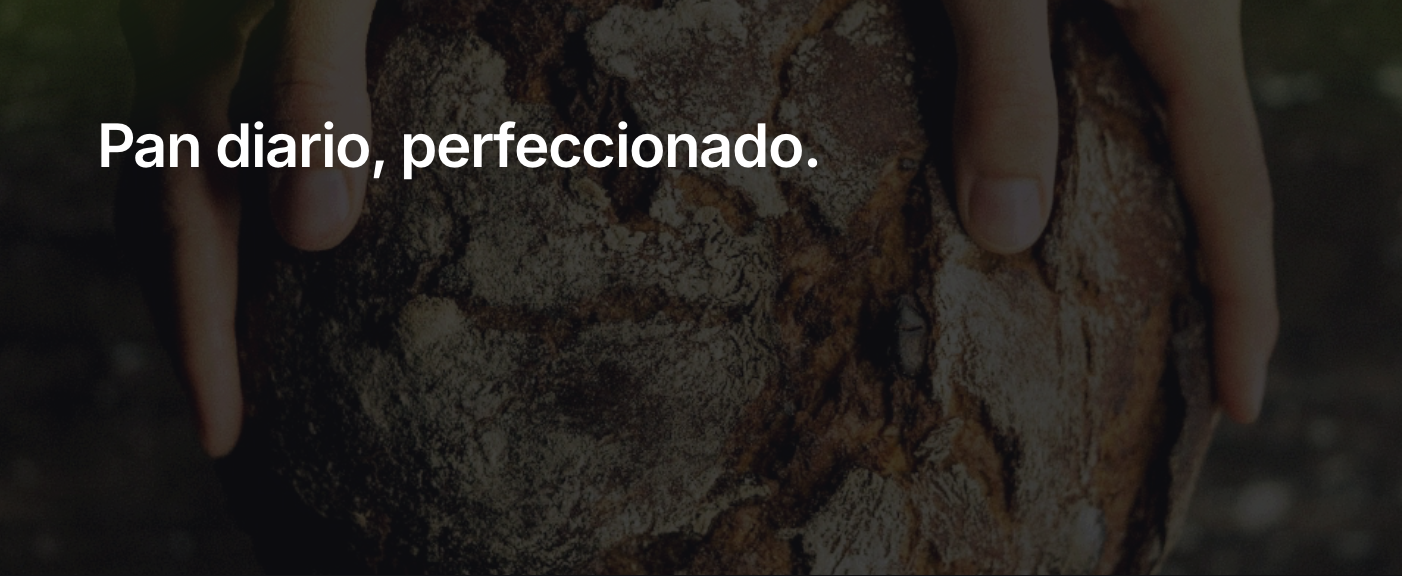 A person receiving a box with freshly baked sliced bread at their home door.